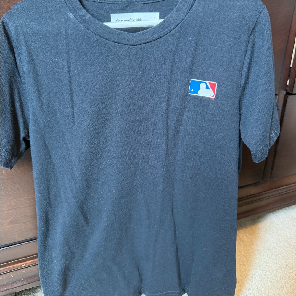 abercrombie kids black tee with small red white and blue MLB logo